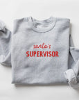 Santa's Supervisor Pullover Saved by Grace Co.