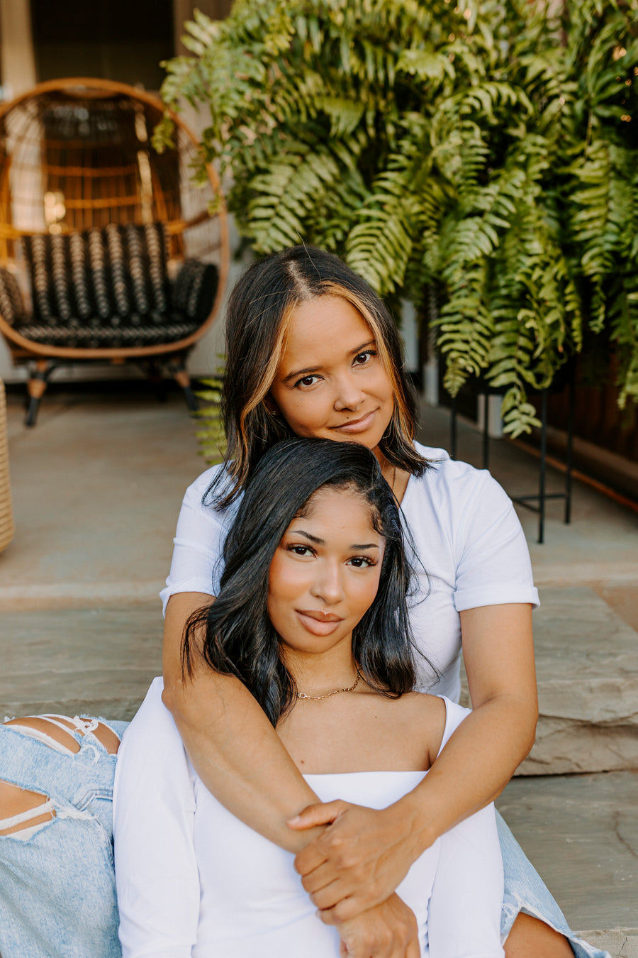 Whitney Vaughn with her arms around her daughter Aiyana, both smiling